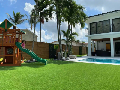 A safe and durable artificial grass play area in a residential or commercial yard in Clearwater Beach.