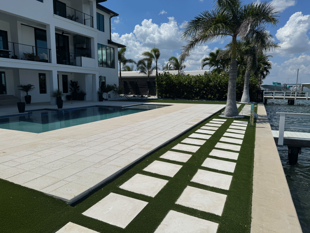 High-quality brick or stone pavers meticulously leveled and installed by JR Landscapes Service for a residential property in St. Pete Beach, Florida. Showcases professional hardscaping craftsmanship and proper base preparation.