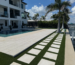 High-quality brick or stone pavers meticulously leveled and installed by JR Landscapes Service for a residential property in St. Pete Beach, Florida. Showcases professional hardscaping craftsmanship and proper base preparation.