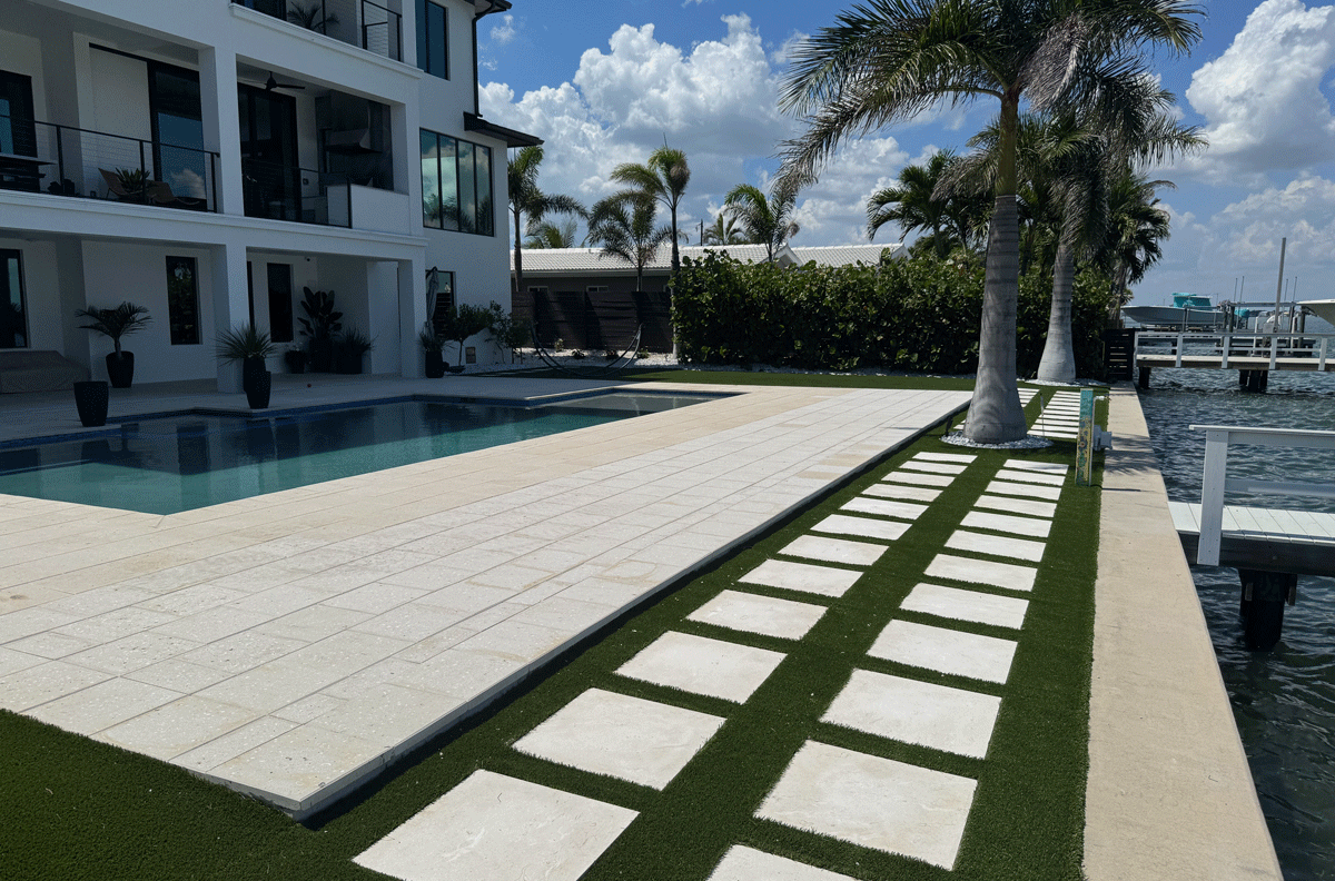 High-quality brick or stone pavers meticulously leveled and installed by JR Landscapes Service for a residential property in St. Pete Beach, Florida. Showcases professional hardscaping craftsmanship and proper base preparation.