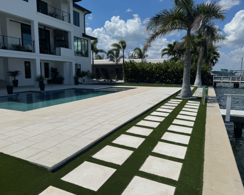 High-quality brick or stone pavers meticulously leveled and installed by JR Landscapes Service for a residential property in St. Pete Beach, Florida. Showcases professional hardscaping craftsmanship and proper base preparation.